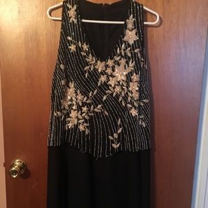 Black sleeveless gown with sequins flowers